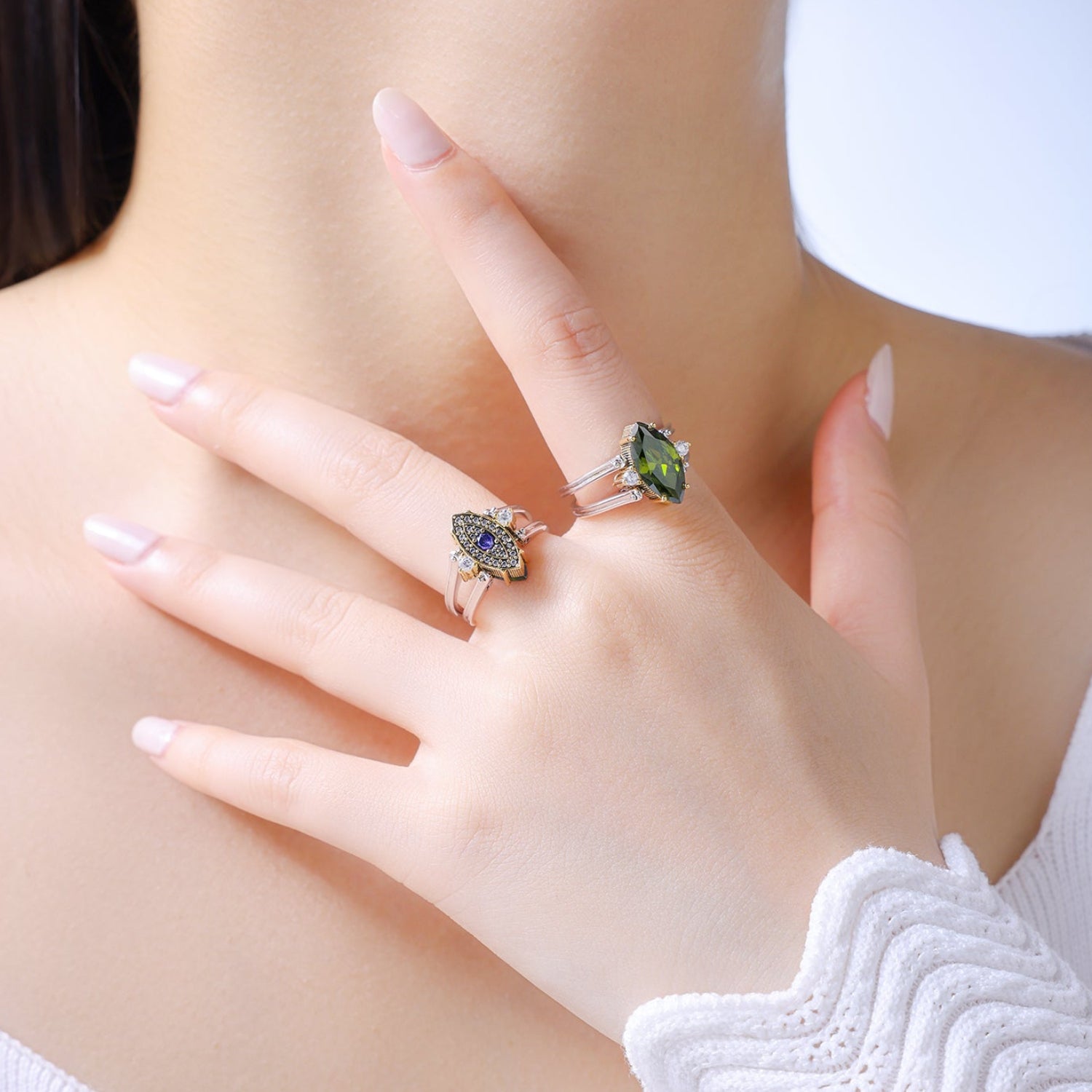 Model wearing Veloura reversible ring in 18K gold and silver.