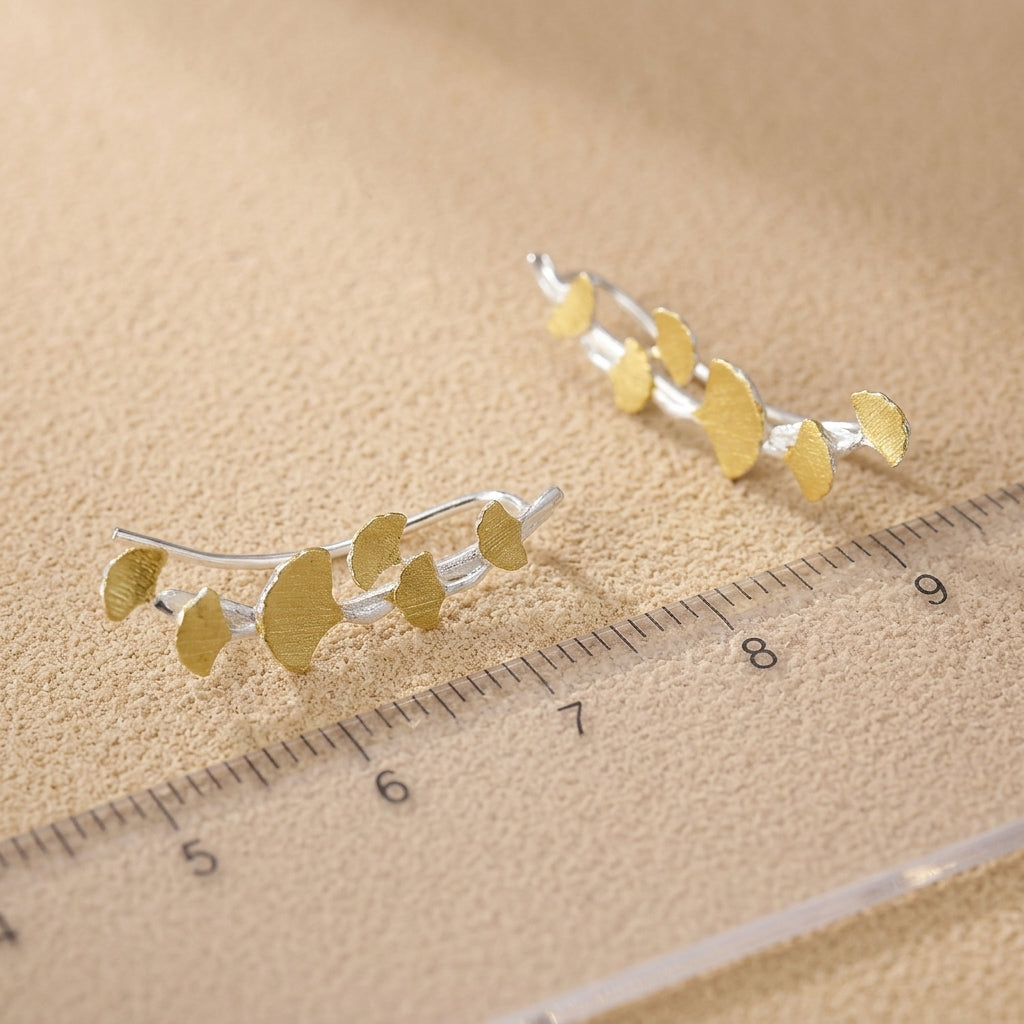 Close-up of ginkgo leaf jewelry, a nature-inspired gift representing hope and enduring love.