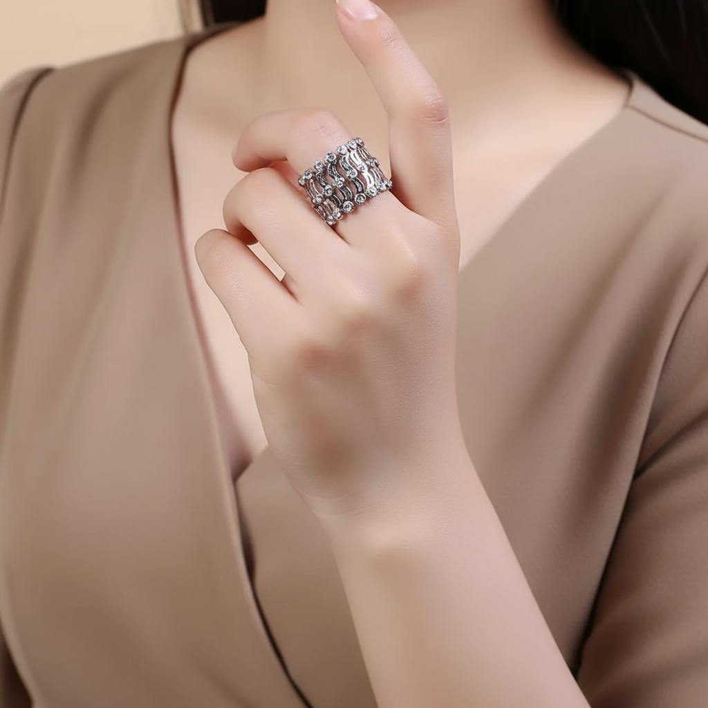 Close-up of a hand wearing a silver ring