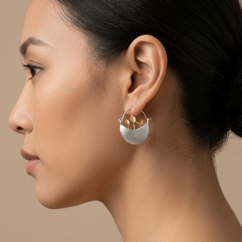 gold-plated floral hoop earrings, showcasing a boho-chic botanical accessory for spring and summer outfits.