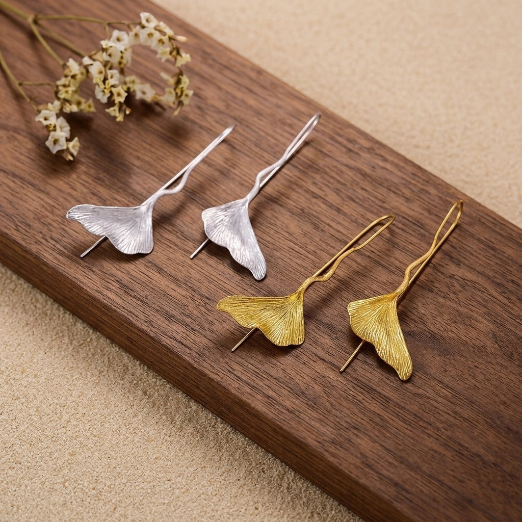 Minimalist sterling silver Ginkgo leaf jewelry featuring a unique long-stem drop design
