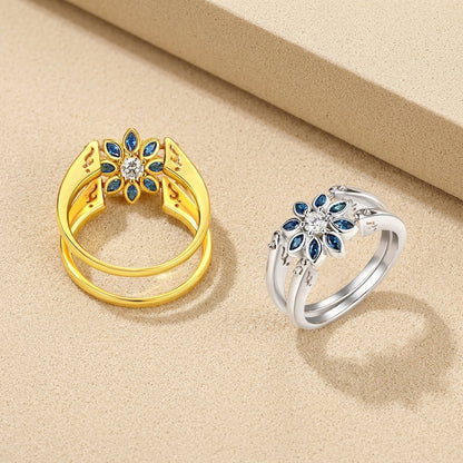 Two-in-one flower motif ring in gold and silver, reversible botanical jewelry piece with dual floral patterns.