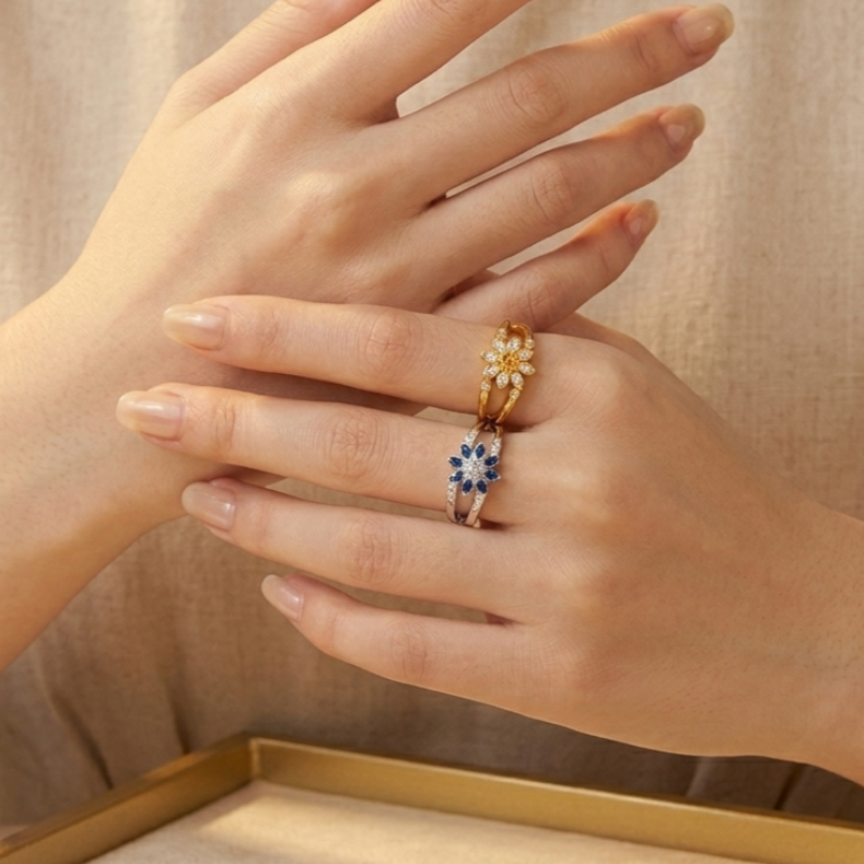 Double-sided flower ring in 18kt gold plated sterling silver featuring two unique floral designs on one band.