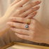 Double-sided flower ring in 18kt gold plated sterling silver featuring two unique floral designs on one band.