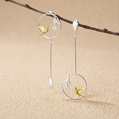 925 sterling silver hummingbird earrings highlighting the intricate wing details and high-shine gold-plated leaf accents