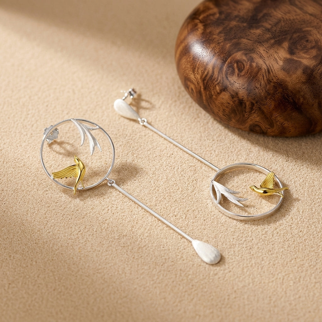 Artisan-made nature earrings with hummingbirds and leaves, a must-have unique accessory for fashion lovers and jewelry collectors