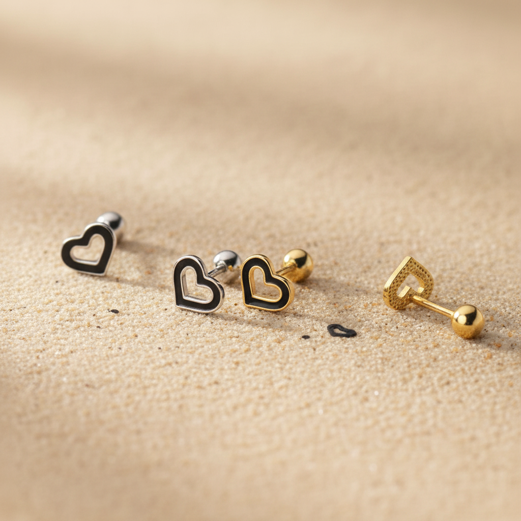 Gold heart stud earrings with secure ball screw backs, hypoallergenic sterling silver jewelry for kids and toddlers.