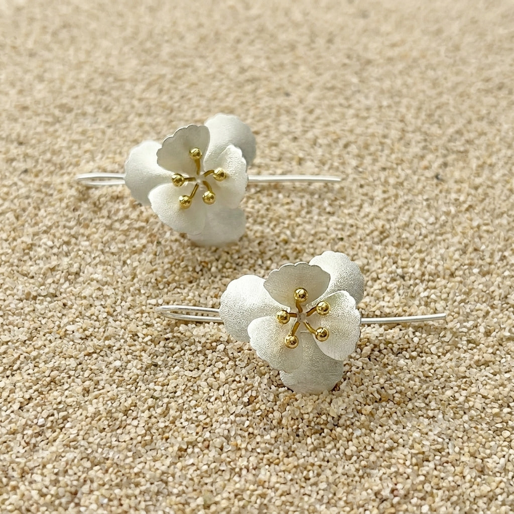 925 sterling silver petal earrings on a neutral background highlighting the fine jewelry craftsmanship