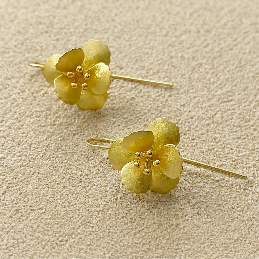 Luxurious 18kt gold-plated sterling silver flower earrings featuring a long, graceful dangle design