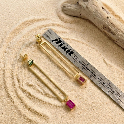 Solene gold-plated bar drop earrings shown next to a ruler for true-to-size scale
