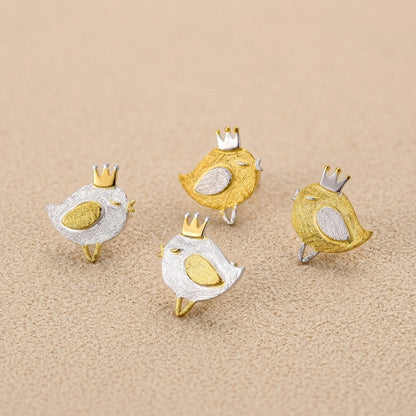 Comparison shot of the tiny bird design earrings available in both polished sterling silver and 18kt gold plated finishes