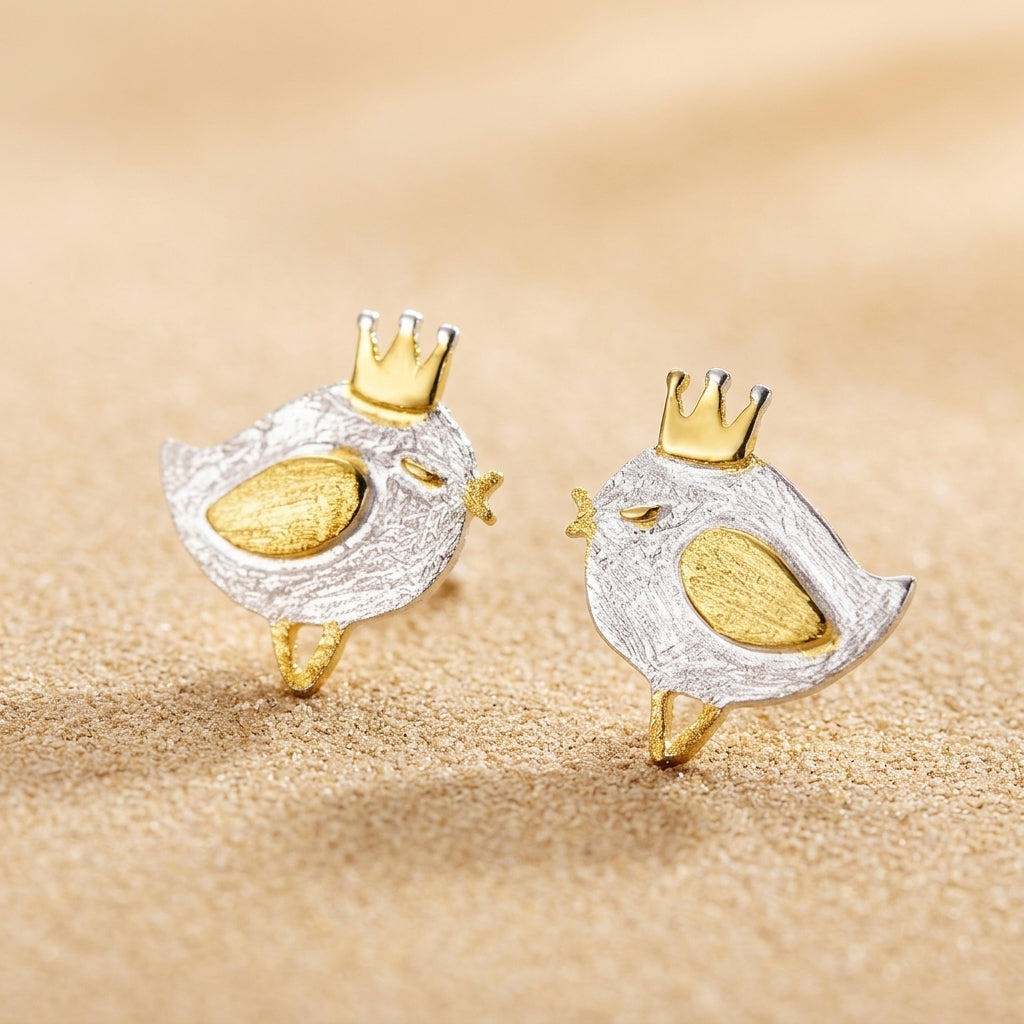 Small gold bird earrings in festive holiday packaging, making a perfect Christmas stocking filler or secret santa gift for women