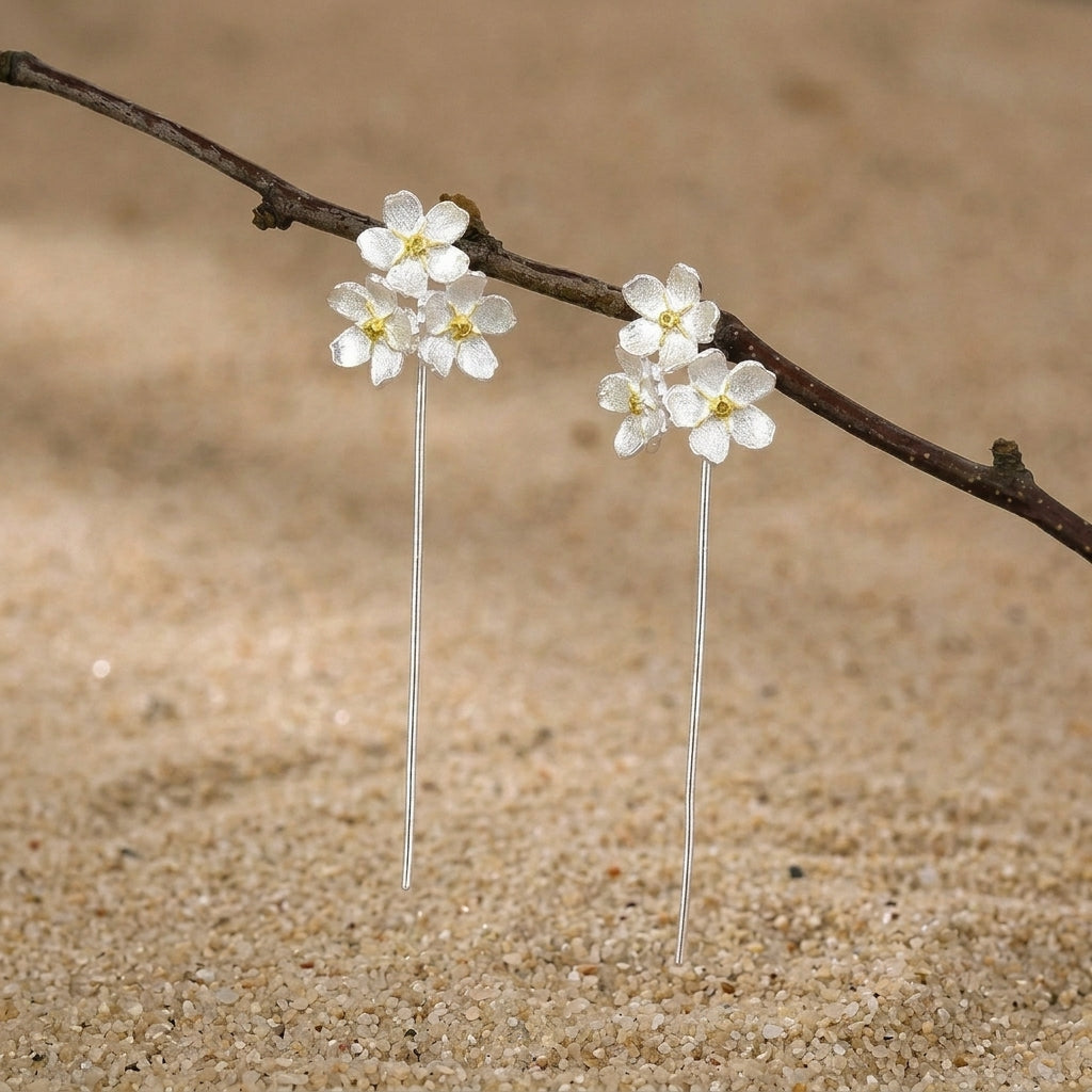 Elegant triple flower drop earrings for women, featuring dainty silver petals that sit as stud for a nature-inspired style